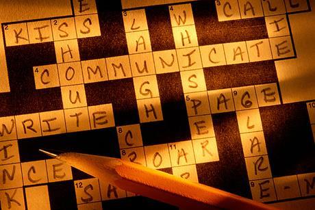 Photo of people playing a language game, if this is too hard, photo of people playing a game indoors.