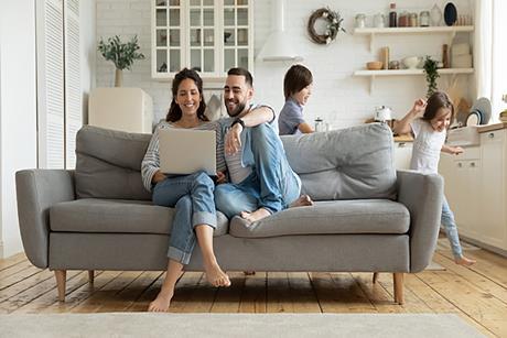 Photo of a family's home, or of a family together at home, e.g.: in the kitchen, in the living room.