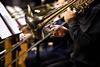 Photo of musicians playing different musical instruments in an orchestra.