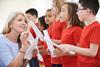 Photo of a group of children and their teacher singing in a classroom.  If too hard, just a photo of children singing.