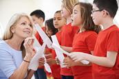 Photo of a group of children and their teacher singing in a classroom.  If too hard, just a photo of children singing.