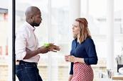 Photo of a groups of teachers speaking to each other.