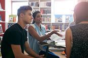 Photo of students doing an  activity together in a classroom. If too hard, then photo of a student doing their homework, can be at home or in a library.