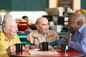 Three old friends having coffee