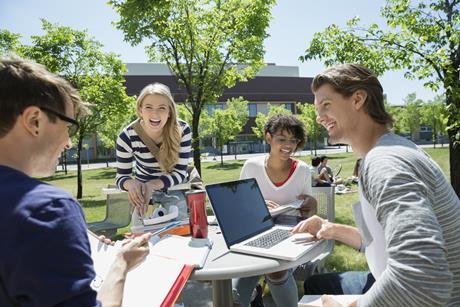 four young adults talking