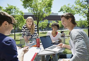 four young adults talking