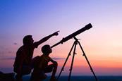 Father and son looking at stars