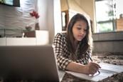 teenage girl studying at home